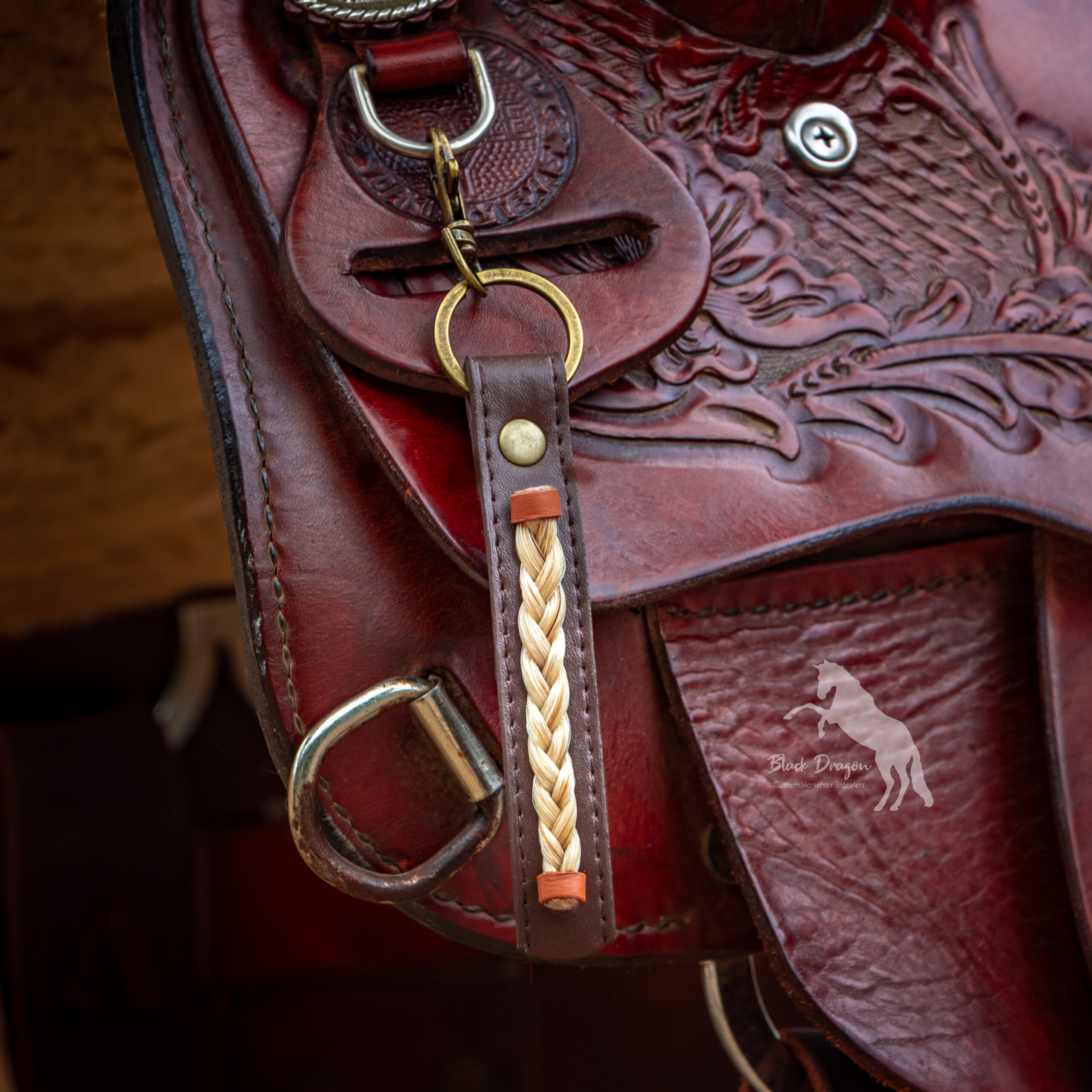 Chocolate Brown Leather Horsehair Keychain on western saddle