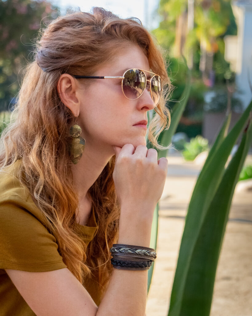 Portrait of Jillian wearing sunglasses and Black Dragon Bracelets